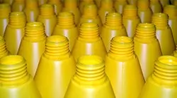 close up of yellow plastic bottles